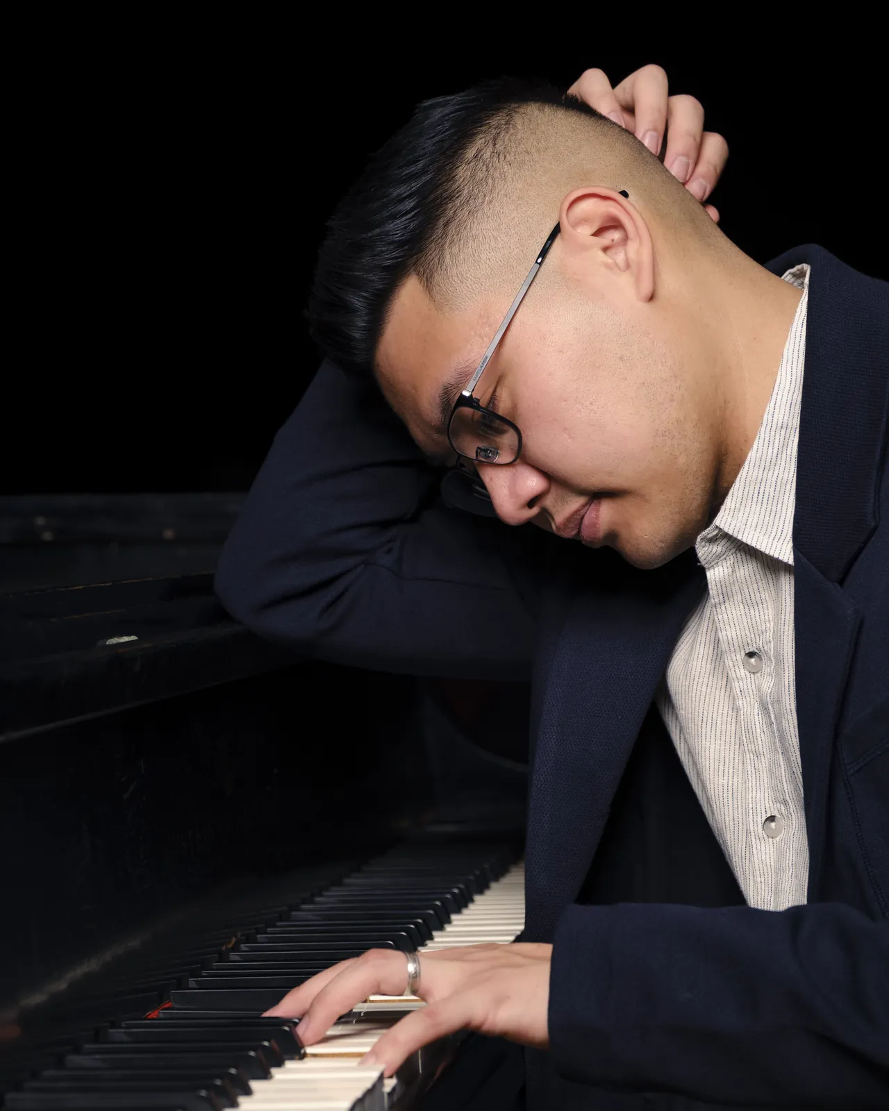 Isaac bent over the piano, deep in the music